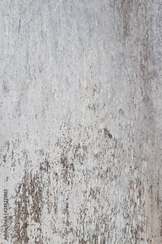 High resolution full frame background of a weathered, faded and dirty gray plywood or hardwood texture. © tuomaslehtinen