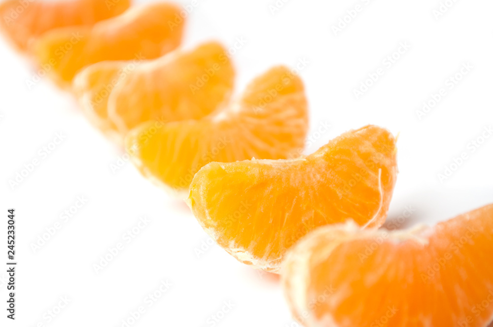 pieces of peeled tangerine alignment on white background pieces of peeled tangerine alignment on white background