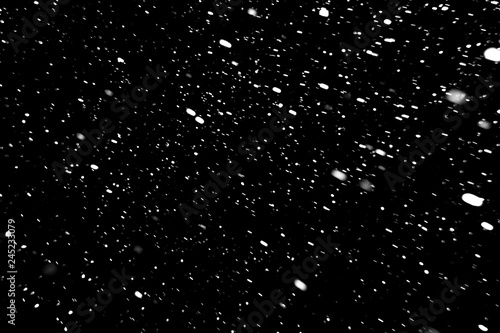 Konstfotografi snow on a black background, falling snow at night, texture with white spots on a