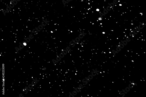 snow on a black background, falling snow at night, texture with white spots on a black background