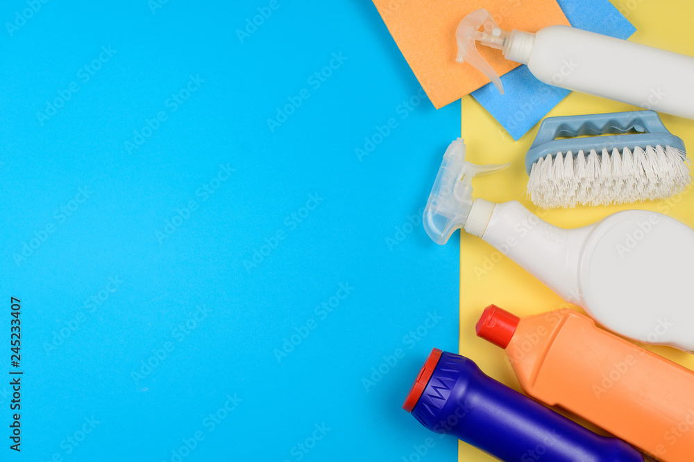 Cleaning products on a yellow background with a copyspace Cleaning products on a yellow background with a copyspace