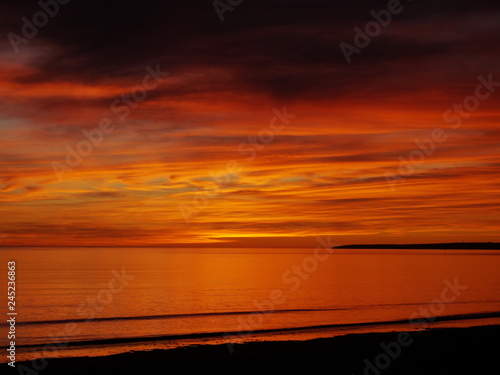 Obraz na płótnie Red sunrise on the Atlantic Ocean w salonie