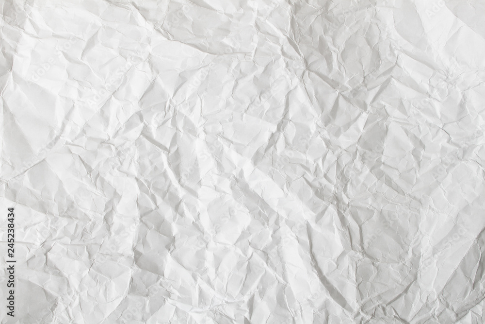 Fototapeta premium White crumpled paper background and texture. Wrinkled creased paper white abstract.