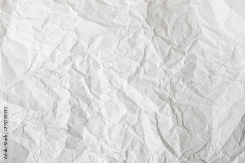 White crumpled paper background and texture. Wrinkled creased paper white abstract.