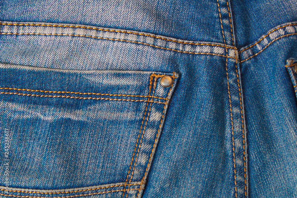 Blank real leather jeans label sewed on old worn blue jeans. Blank real leather jeans label sewed on old worn blue jeans.
