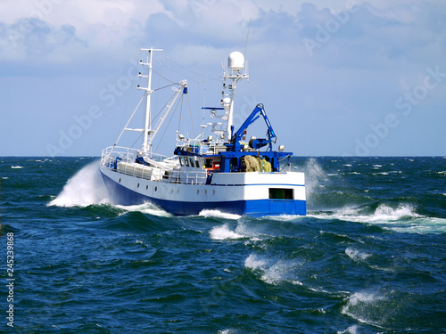 Fishing boat underway at sea to fishing grounds.
