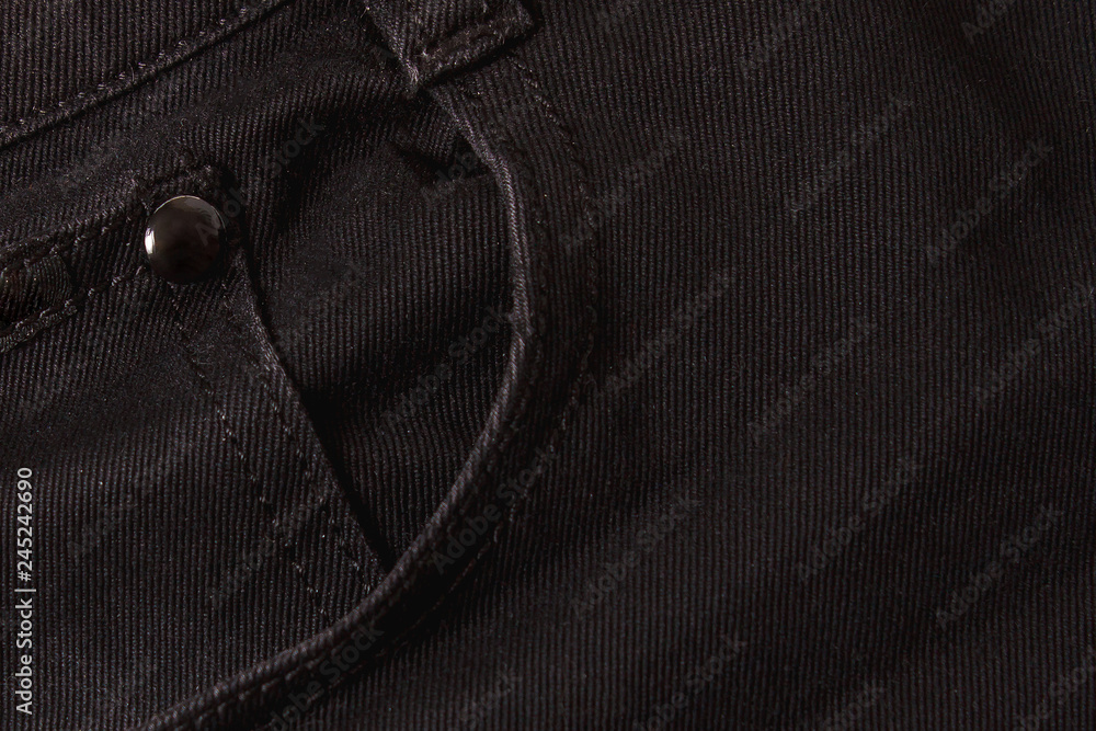 Texture background of black jeans and pockets Texture background of black jeans and pockets