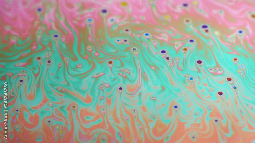 Psychedelic background of motion surface of colorful soap bubble Psychedelic background of motion surface of colorful soap bubble