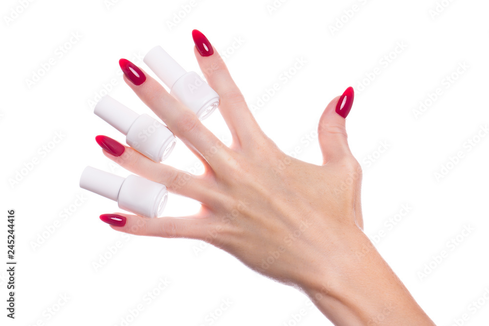 Bright festive red manicure on female hands. Nails design Bright festive red manicure on female hands. Nails design