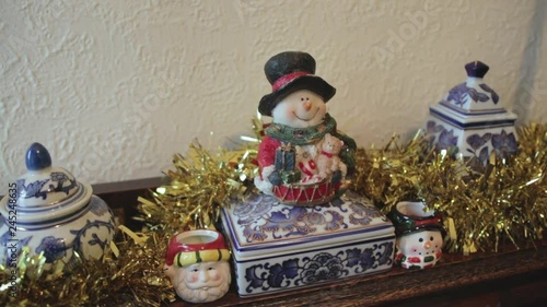 Shot moving around a snowman decoration during christmas