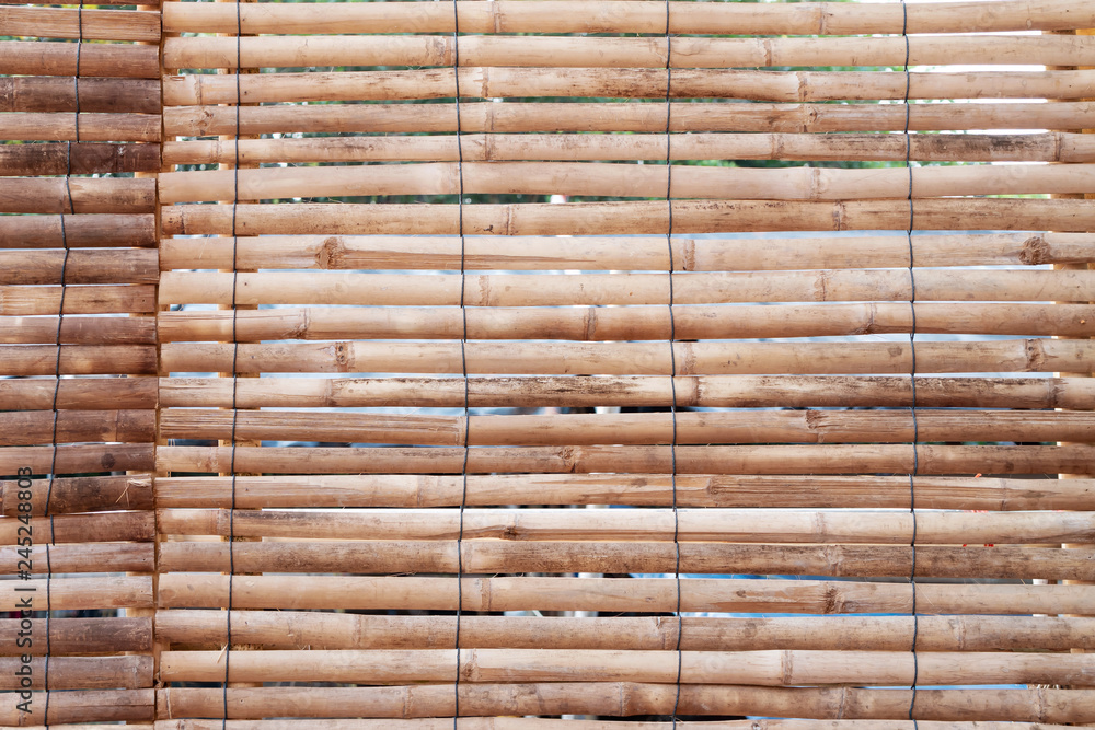 Bamboo arranged horizontally with black tie rope Bamboo arranged horizontally with black tie rope