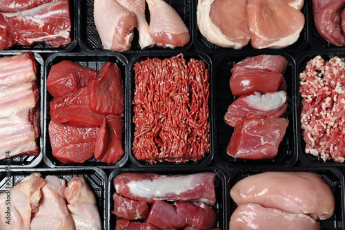 Containers with different raw meat, top view