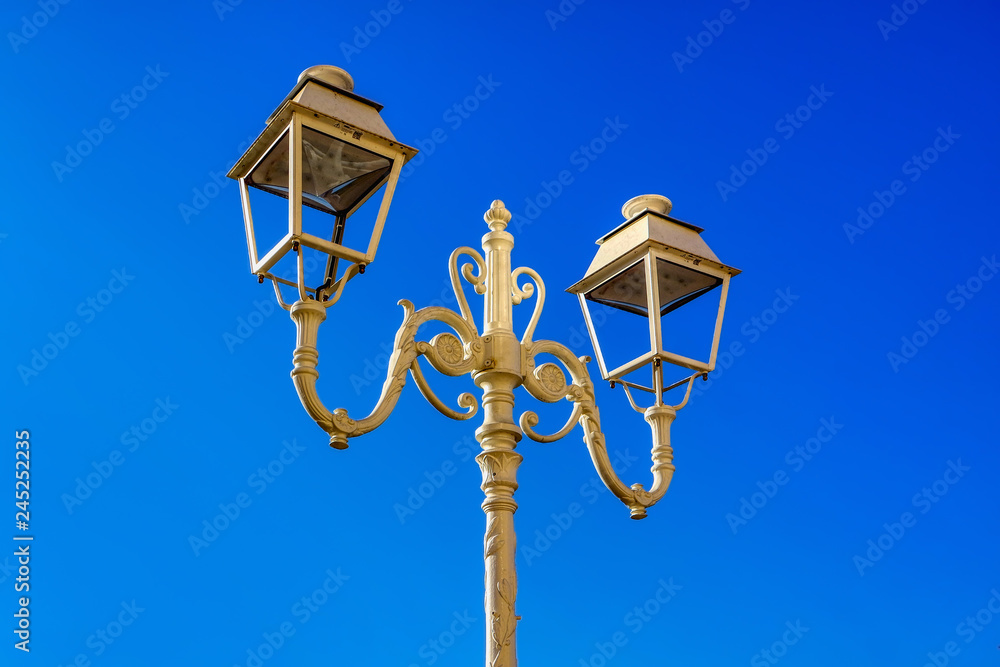 Street white iron lamp post with two led lamp, Toulon, France