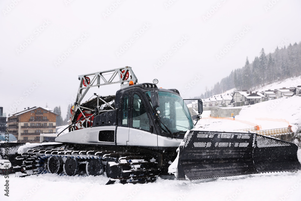 New modern snow plow at mountain resort New modern snow plow at mountain resort