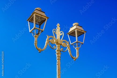 Obraz na płótnie Street white iron lamp post with two led lamp, Toulon, France w salonie