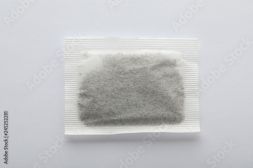 Unused tea bag on white background, top view