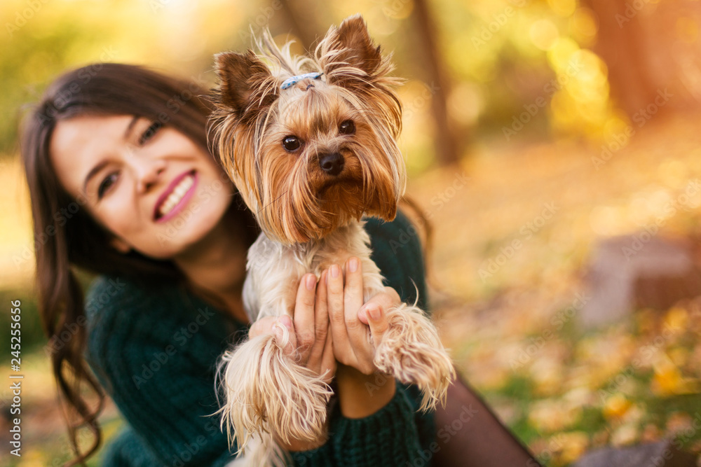 Beautiful woman playing with dog in the park Beautiful woman playing with dog in the park