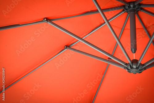 view of under umbrella / shade in red umbrella background on the beach