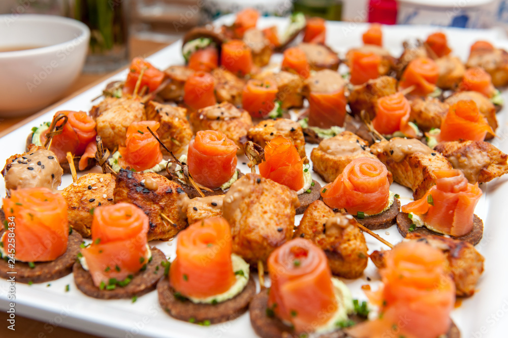 Red salmon appetizers on bread slices Red salmon appetizers on bread slices