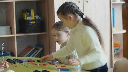 girls playing with a constructor photo