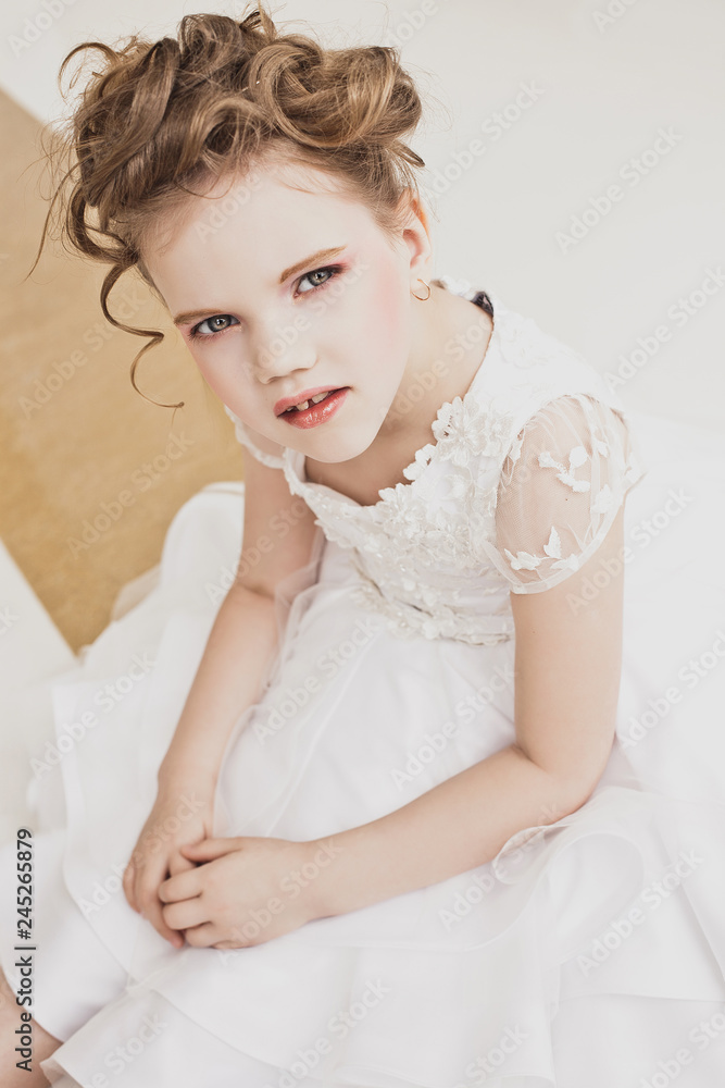 little girl with blond hair wearing white dress. little girl with blond hair wearing white dress.