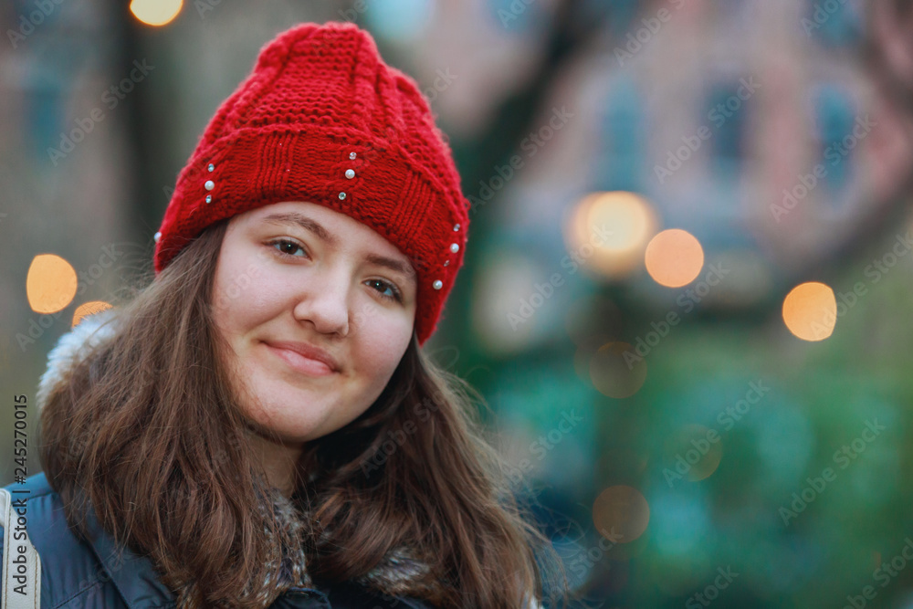 Close up portrait of a beautiful smiling girl with brown hair colorful lights bokeh Close up portrait of a beautiful smiling girl with brown hair colorful lights bokeh