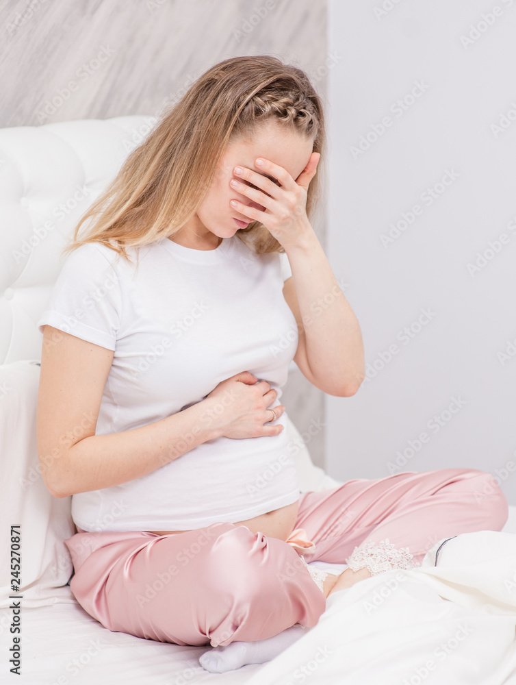 Crying pregnant woman at bedroom Crying pregnant woman at bedroom