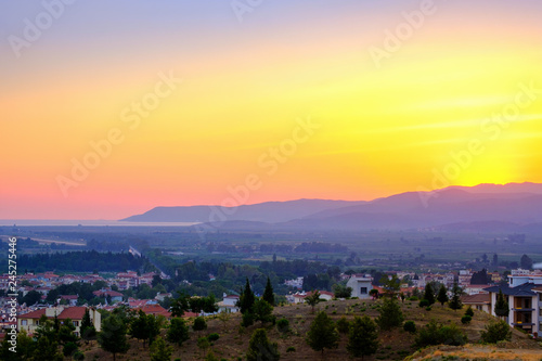 Selcuk, Turkey. Panorama of the view of the city and the mountains at sunset.
