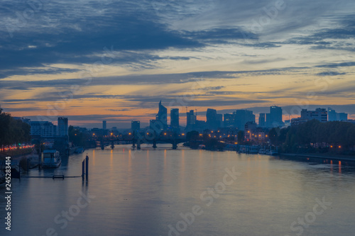 Paris, France - 11 04 2018: View of the towers of La Défense district from the Clichy bridge at sunset