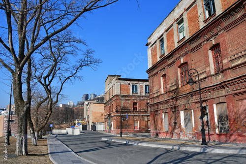 Vladivostok, Russia, January 19, 2019. Former artillery workshops on the Tsesarevich embankment in sunny winter weather photo