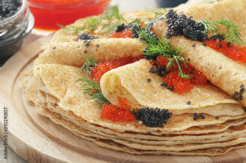 Russian pancakes with red and black caviar