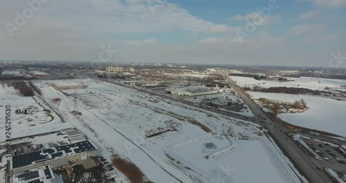 Low Panorama Of Industrial Section And Farmland In Winter Time Aerial View photo