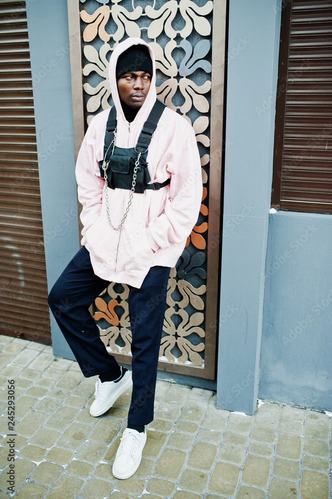 Stylish urban style african american man in pink hoodie posed. Afro rapper  guy. Stock Photo | Adobe Stock