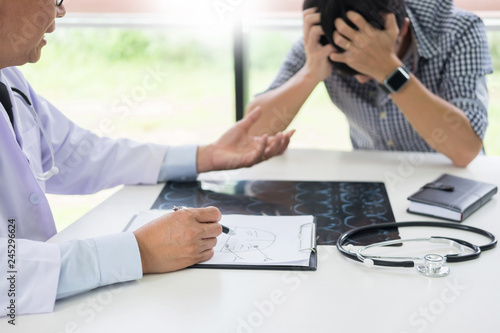 Patient Being Reassured desperate holding hand By Doctor encouraging support and comforting with sympathy. In Hospital Room.