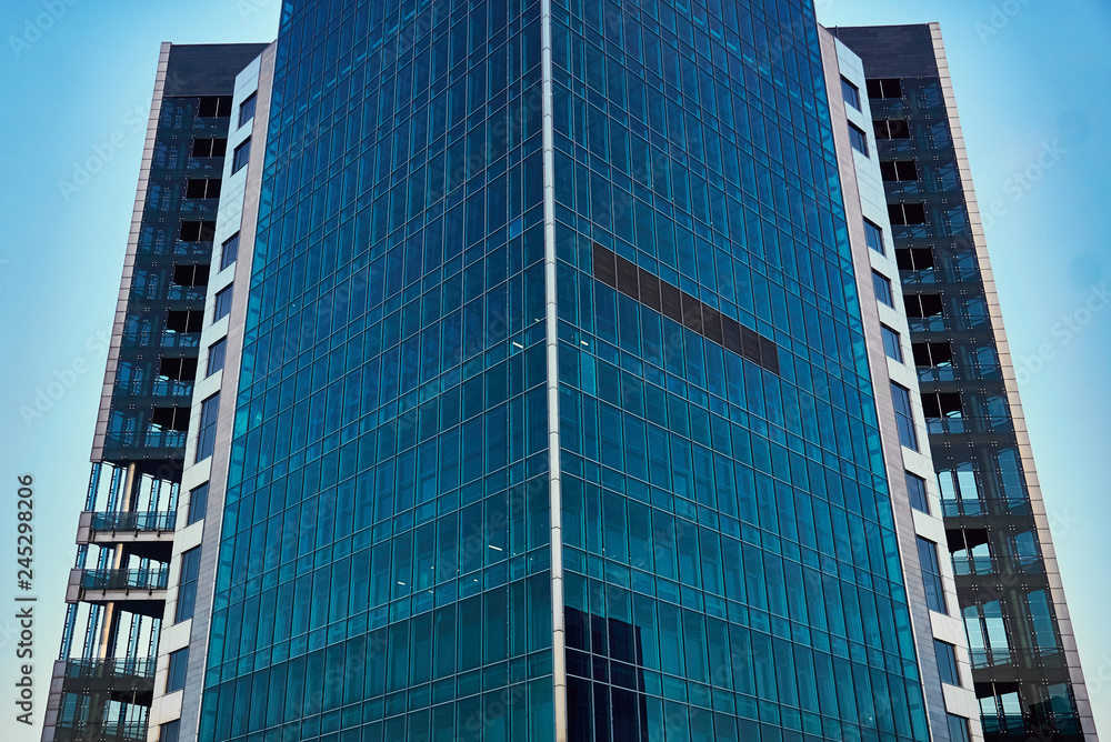 Fototapeta premium modern skyscraper with panoramic blue Windows