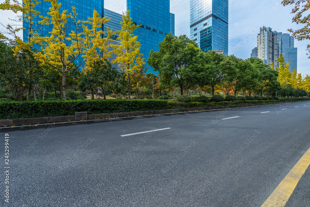 city empty traffic road with cityscape in background.