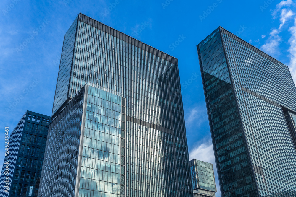 Modern office building against blue sky.