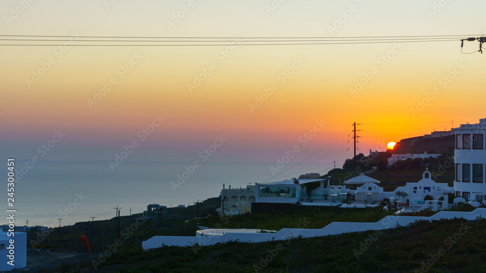Beautiful Sunrise landscape with white architecture on Santorini island, Greece.