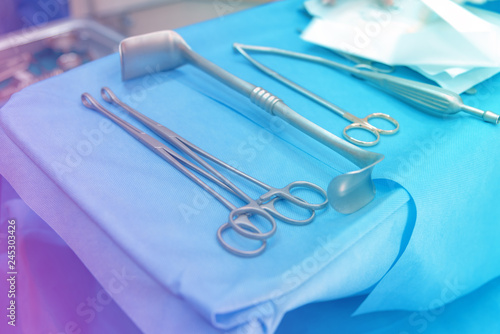 Surgical instruments on the sterile table in the emergency operation room in the hospital.Medical instruments for surgery concept,toned effect