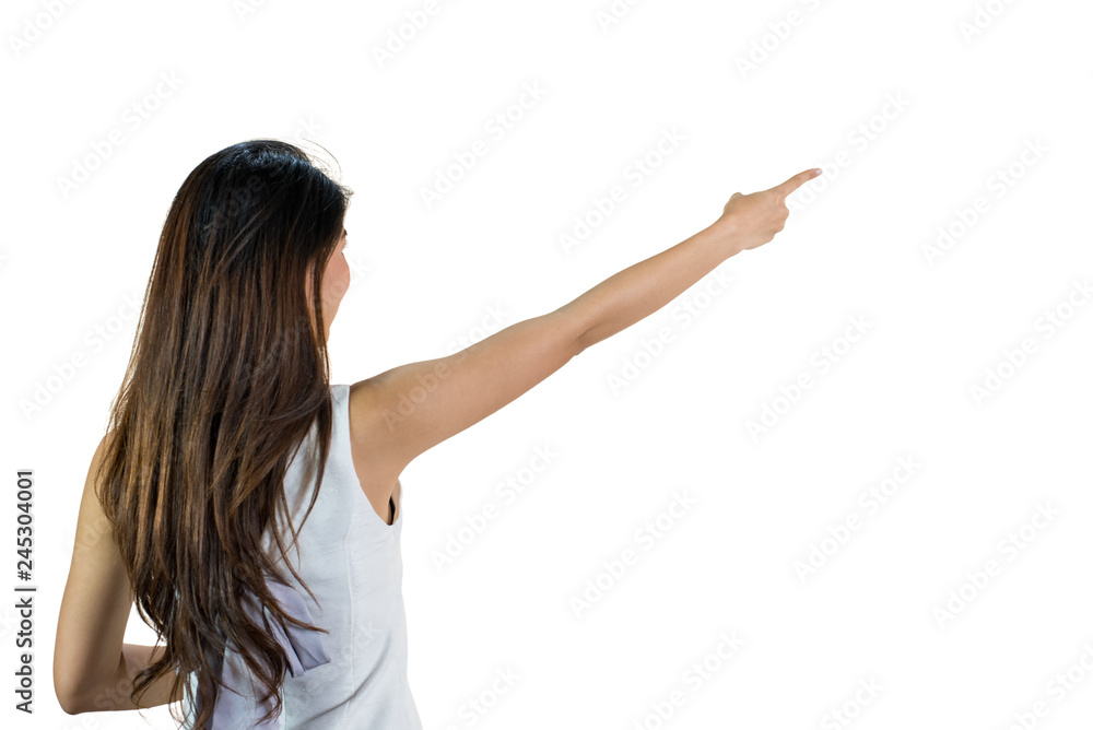 Back side body of Young asian woman standing pointing to something,long hairs black color, isolated on a white background Back side body of Young asian woman standing pointing to something,long hairs black color, isolated on a white background