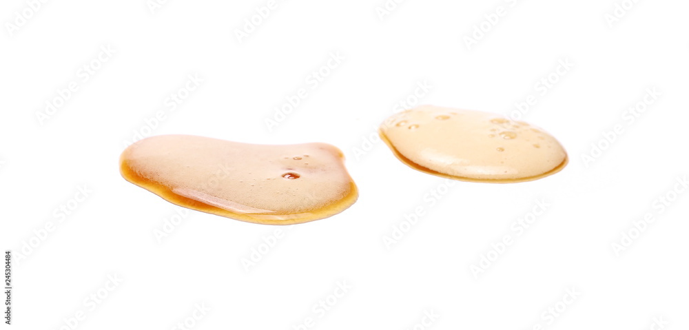 Spilled beer puddle with foam isolated on white background and texture Spilled beer puddle with foam isolated on white background and texture