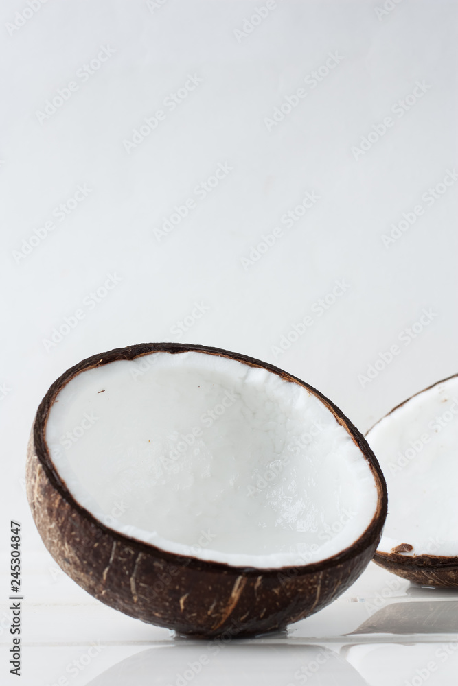 Half a fresh coconut on a white background Half a fresh coconut on a white background