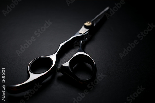 professional scissors on black background