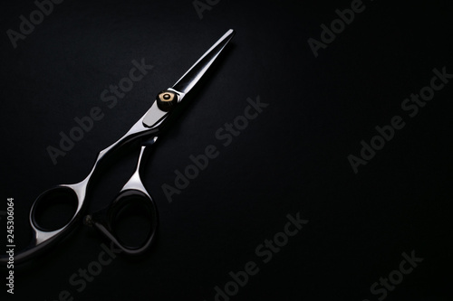 professional scissors on black background