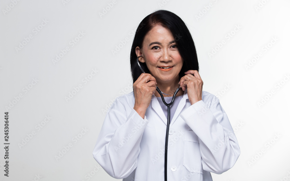 Asian Beautiful Senior Doctor Nurse woman in uniform with stethoscope in Medical hospital, portrait 50s 60s years old aging society make up black short hair, studio lighting gray background copy space Asian Beautiful Senior Doctor Nurse woman in uniform with stethoscope in Medical hospital, portrait 50s 60s years old aging society make up black short hair, studio lighting gray background copy space