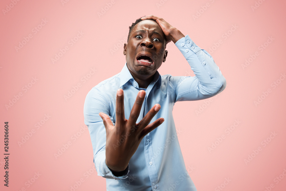 Why is that. Beautiful male half-length portrait isolated on trendy pink studio backgroud. Young emotional surprised, frustrated and bewildered man. Human emotions, facial expression concept. Why is that. Beautiful male half-length portrait isolated on trendy pink studio backgroud. Young emotional surprised, frustrated and bewildered man. Human emotions, facial expression concept.