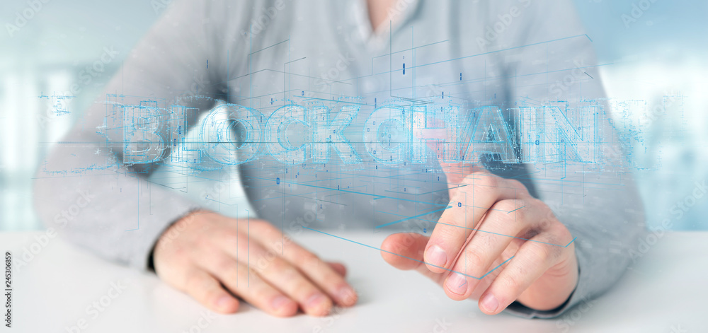 Man holding a Blockchain title isolated on a background Man holding a Blockchain title isolated on a background