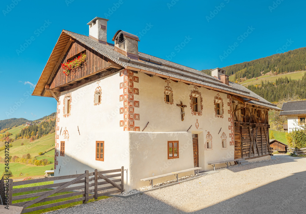 Typical Tyrol wooden alpine house architecture decorated with flowers