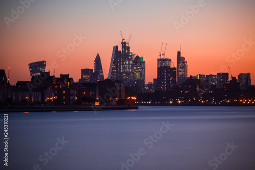 Illuminated London cityscape with beautiful sunset