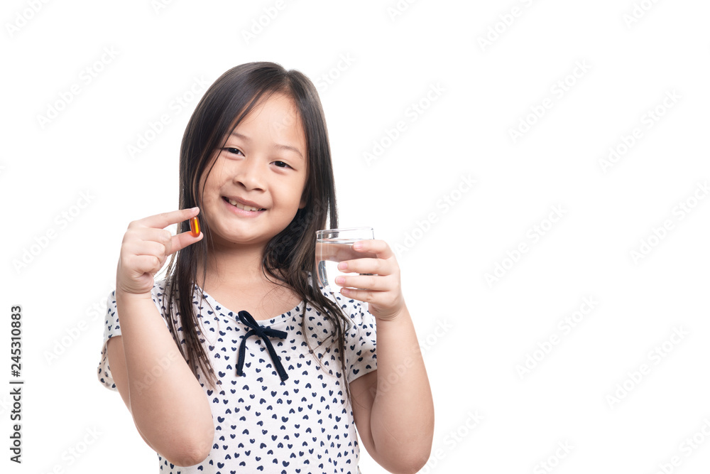 Cute kid southeast asian girl age 7 years take pill or vitamin lecithin Cute kid southeast asian girl age 7 years take pill or vitamin lecithin